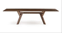 A modern dark brown wooden dining table with a rectangular top and a unique geometric A-frame base, shown against a plain white background.