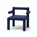 A modern navy blue upholstered armchair with a blocky, cylindrical design, featuring a padded seat and armrests, set against a plain light gray studio background.